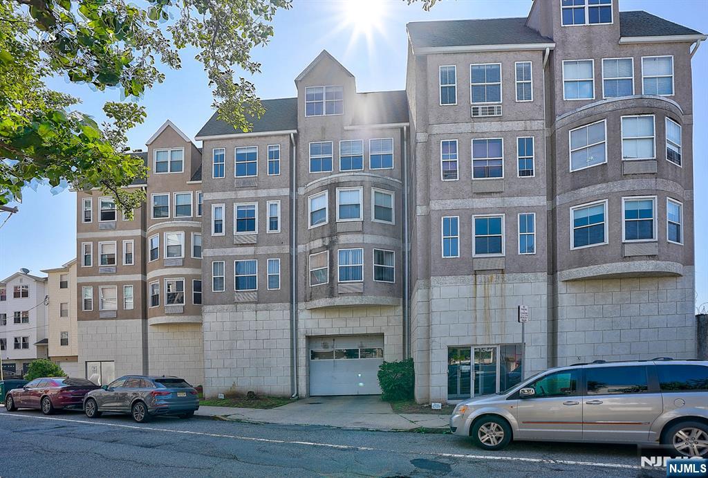 54 Polk Street, Unit P3 Newark, NJ 07105 - Photo 1 of 26 a car parked in front of a building