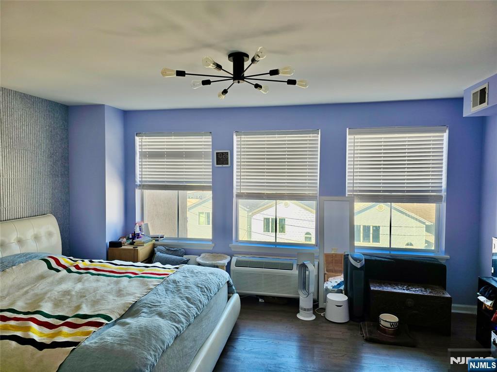 54 Polk Street, Unit P3 Newark, NJ 07105 - Photo 12 of 26 a bedroom with a bed and a window