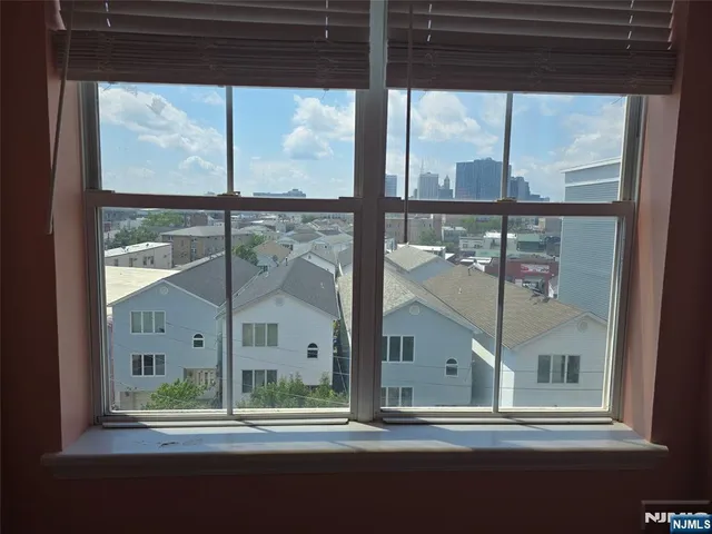 a aerial view of residential houses with city street