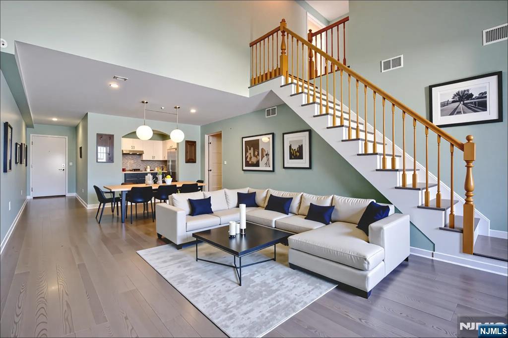 54 Polk Street, Unit P3 Newark, NJ 07105 - Photo 3 of 26 a living room with furniture and wooden floor