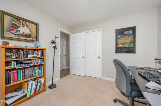 a workspace with a bookshelf and a workspace