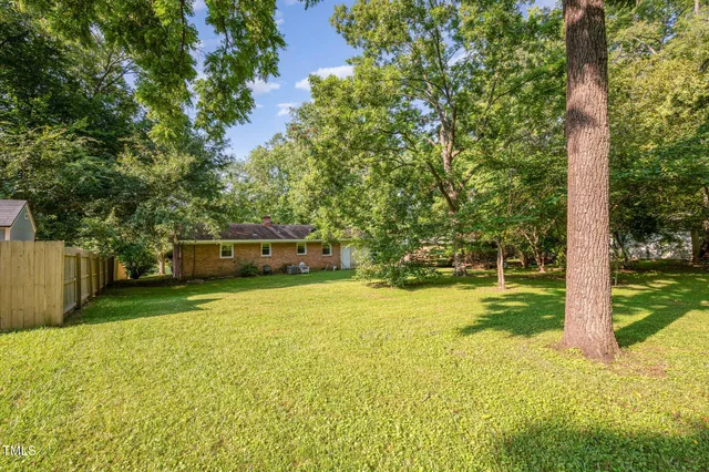 a view of a swimming pool with an outdoor space and seating area