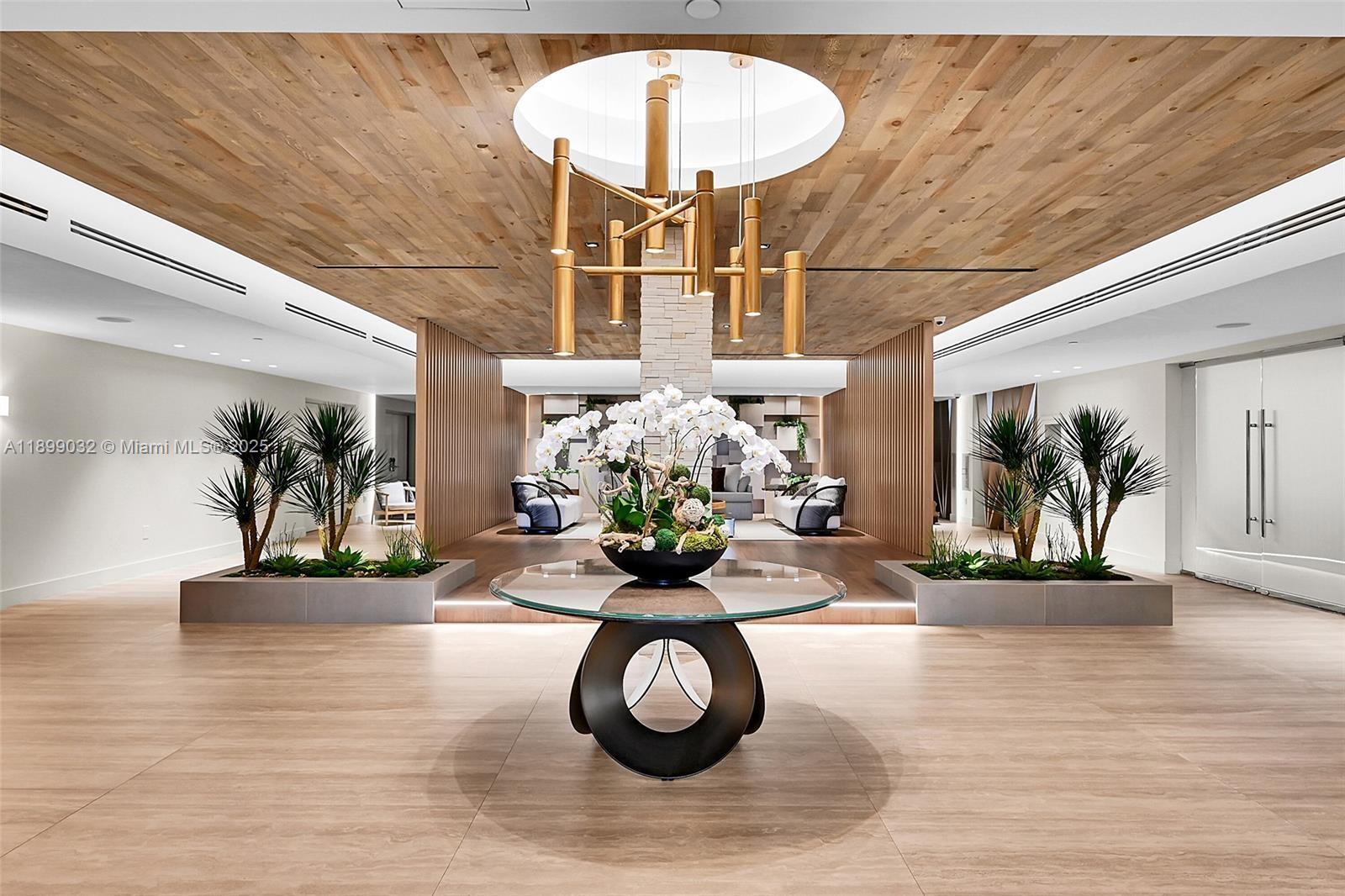 2301 Collins Avenue, Unit 736 Miami Beach, FL 33139 - Photo 13 of 15 a view of a lobby with furniture and chandelier