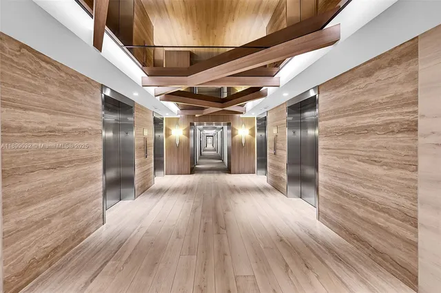 a view of hallway with wooden floor