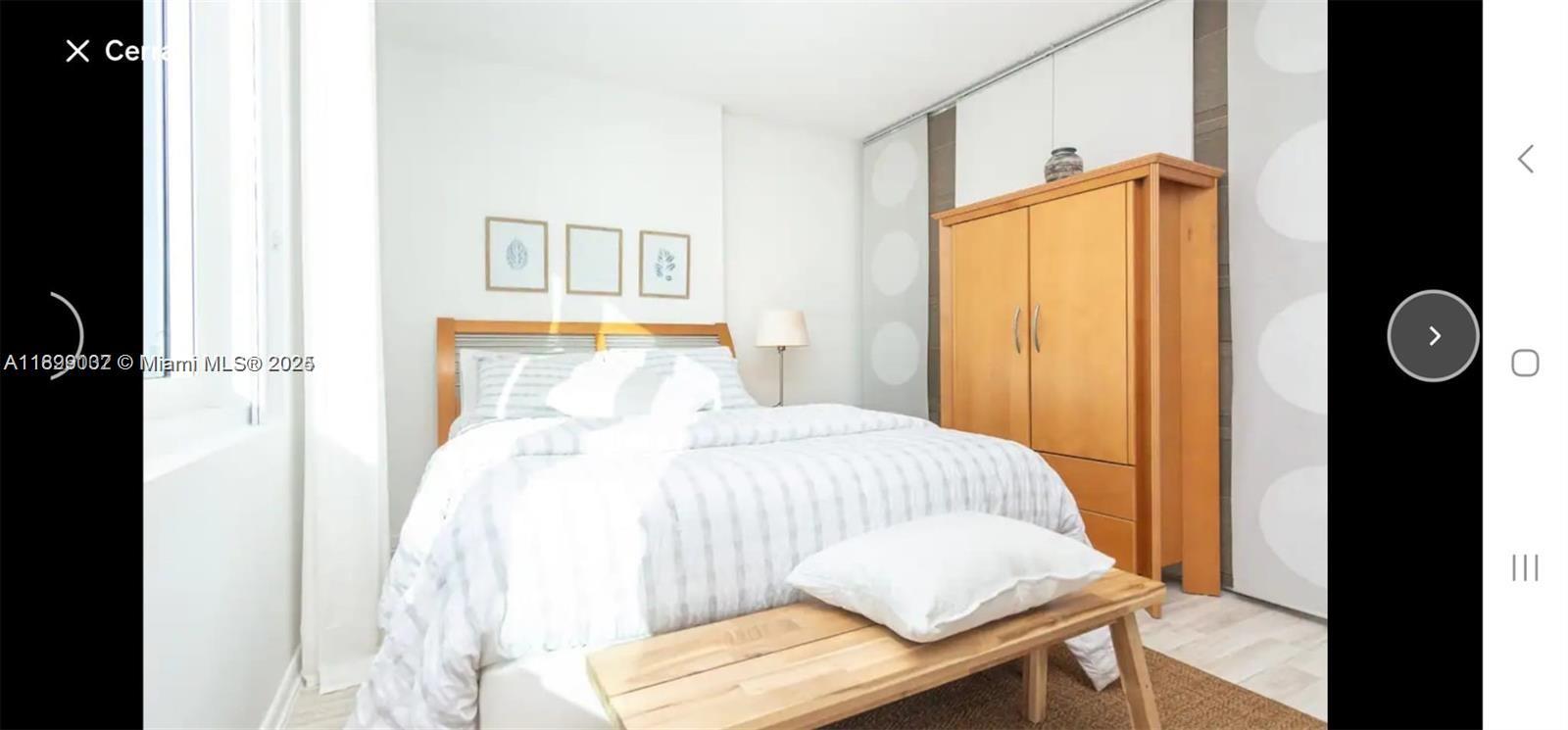 2301 Collins Avenue, Unit 736 Miami Beach, FL 33139 - Photo 3 of 15 a bedroom with a bed and a window