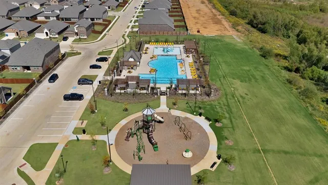 an aerial view of a house with a swimming pool