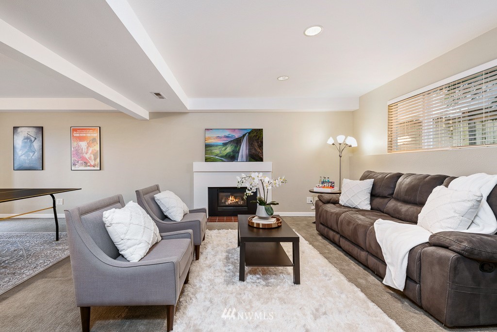 21913 8th Place West Bothell, WA 98021 - Photo 22 of 33 a living room with furniture and a fireplace
