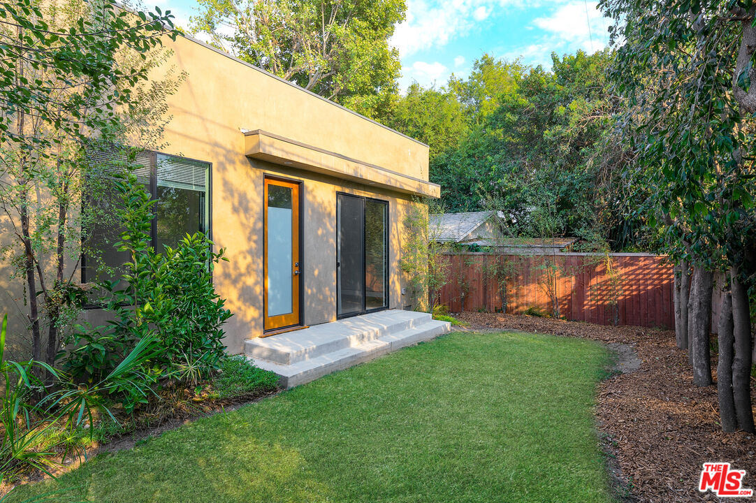 4351 McConnell Boulevard Culver City, CA 90066 - Photo 3 of 4 a view of a backyard with large tree