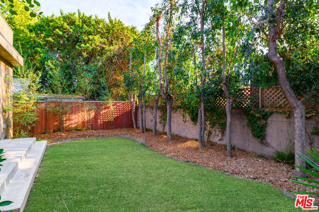4351 McConnell Boulevard Culver City, CA 90066 - Photo 4 of 4 a view of a backyard with a tree