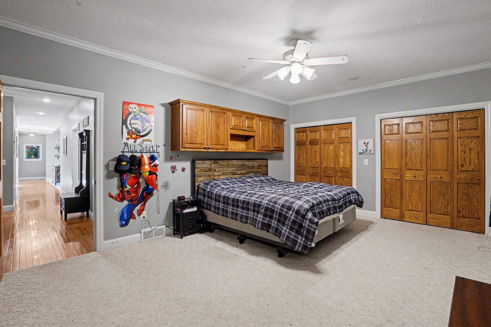 918 Melody Hills Fulton, IL 61252 - Photo 16 of 43 a bedroom with a bed and a chandelier