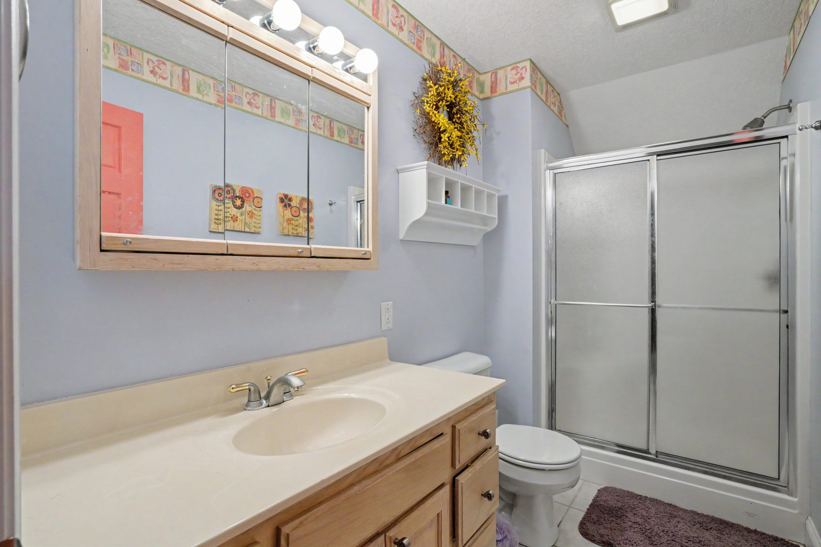 918 Melody Hills Fulton, IL 61252 - Photo 20 of 43 a bathroom with a sink toilet and vanity