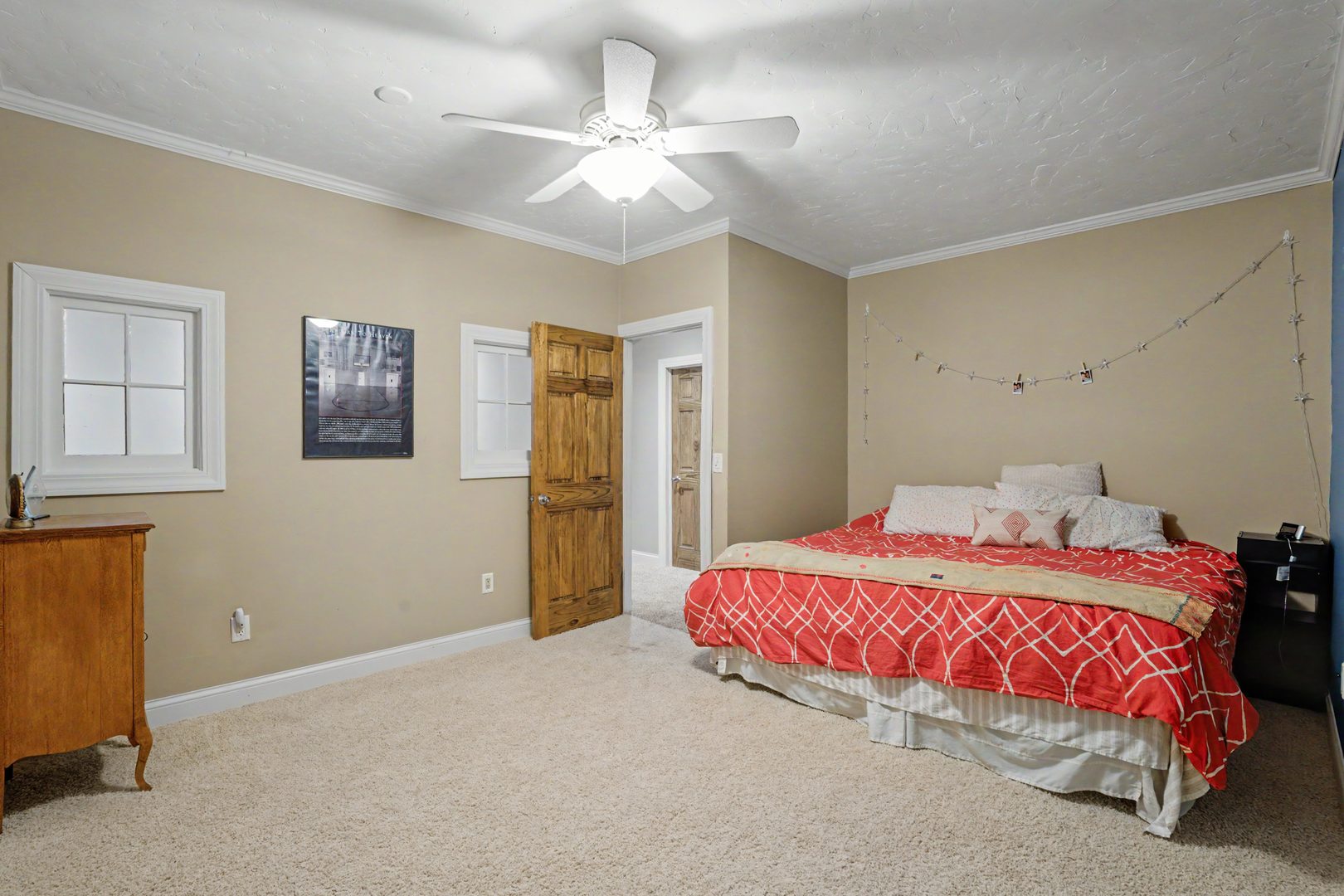 918 Melody Hills Fulton, IL 61252 - Photo 23 of 43 a bedroom with a bed and a chandelier