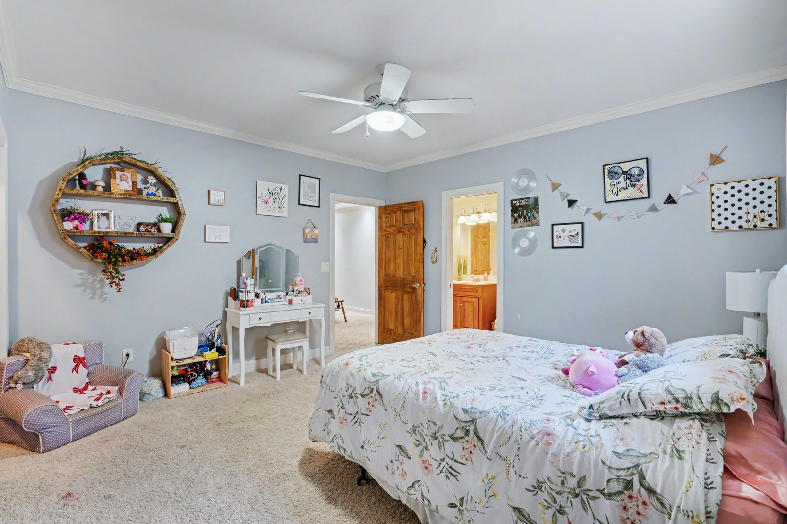 918 Melody Hills Fulton, IL 61252 - Photo 25 of 43 a bedroom that has a bed and a chandelier
