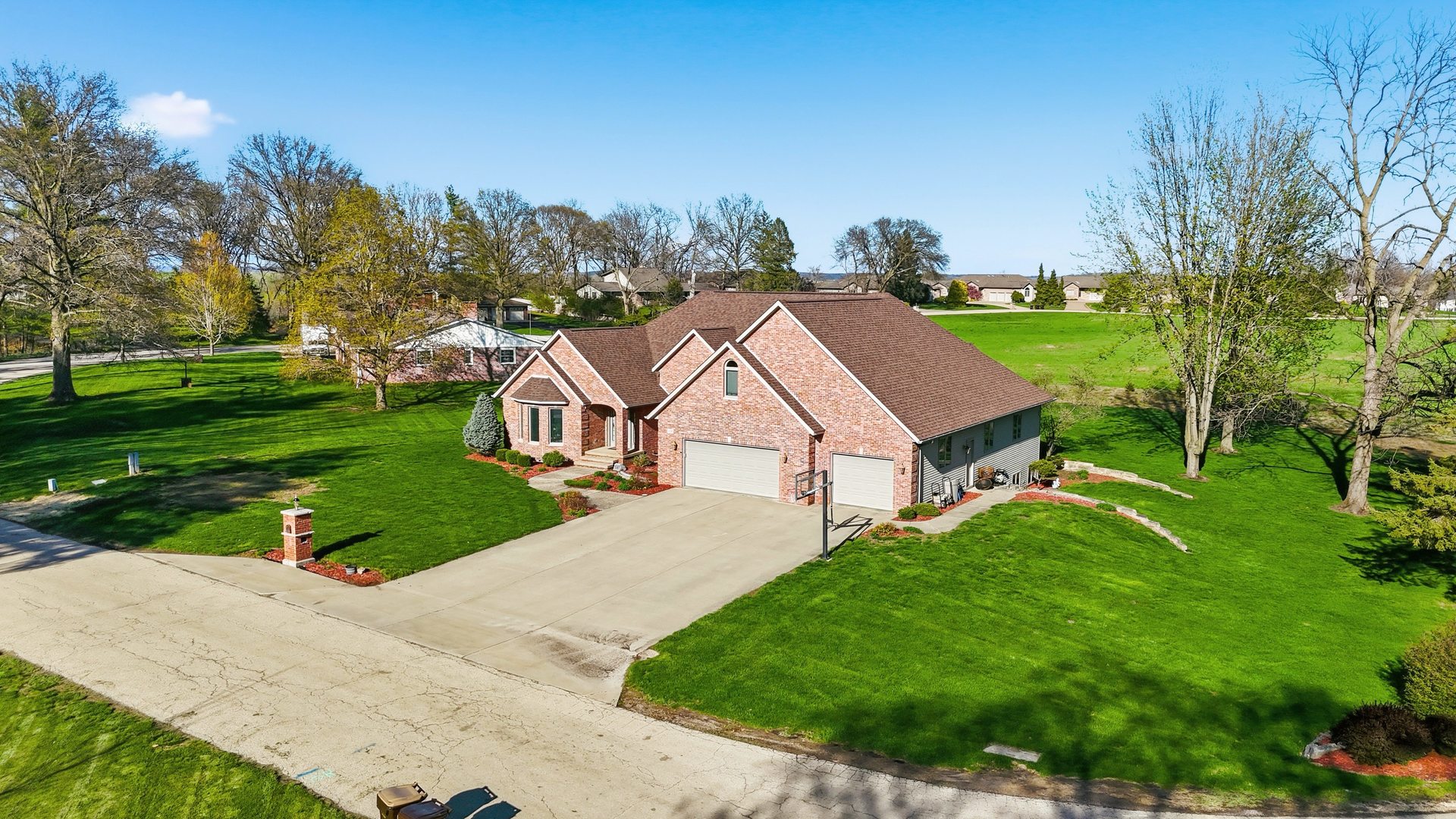 918 Melody Hills Fulton, IL 61252 - Photo 36 of 43 a front view of a house with a yard and trees