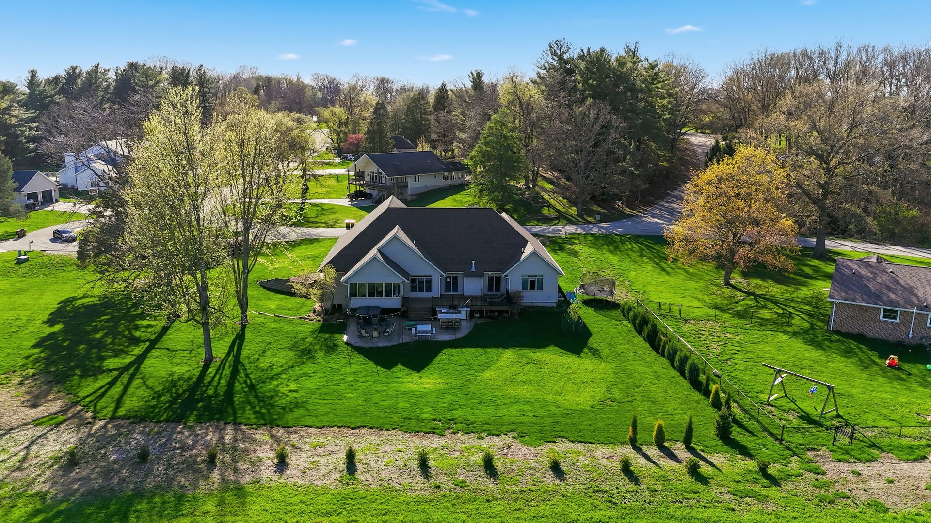 918 Melody Hills Fulton, IL 61252 - Photo 39 of 43 a view of a house with a big yard potted plants and large tree