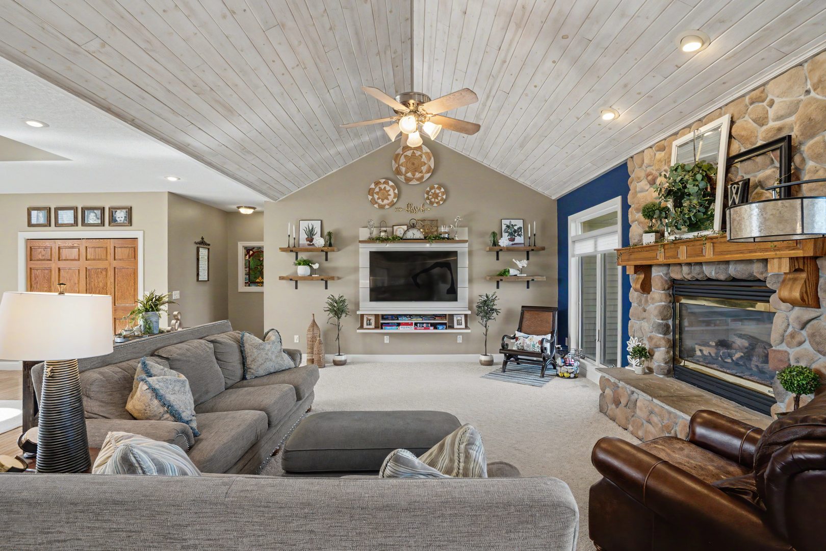 918 Melody Hills Fulton, IL 61252 - Photo 10 of 43 a living room with furniture a fireplace and a flat screen tv