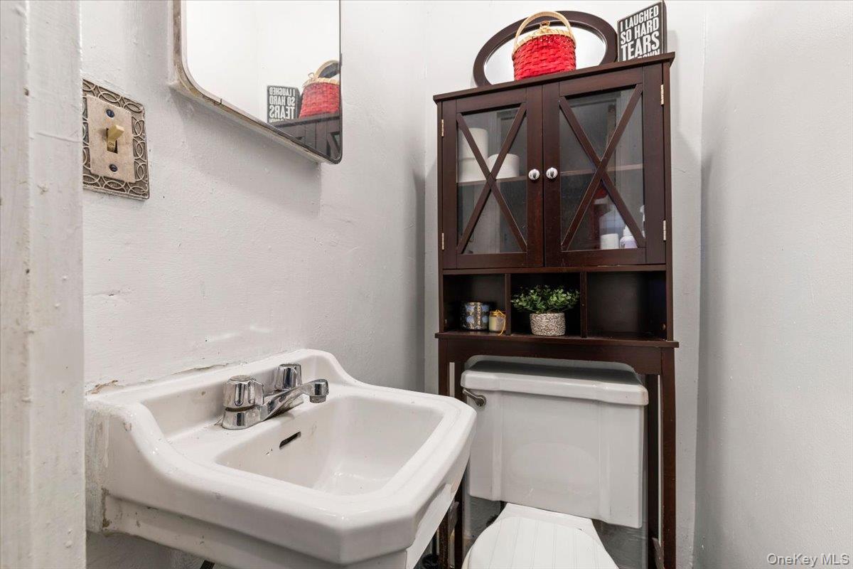 2761 Hering Avenue Bronx, NY 10469 - Photo 14 of 29 Bathroom featuring a sink and toilet