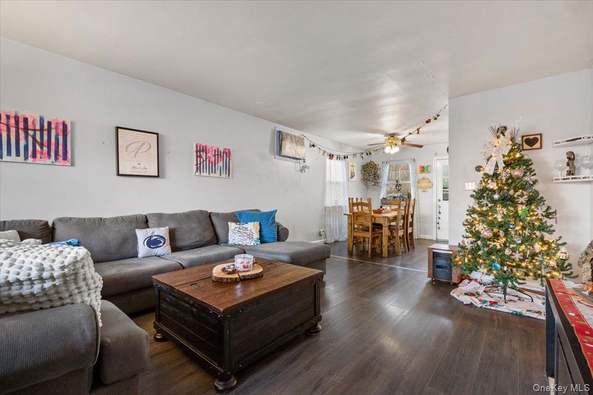2761 Hering Avenue Bronx, NY 10469 - Photo 5 of 29 Living area featuring dark wood-style floors and ceiling fan