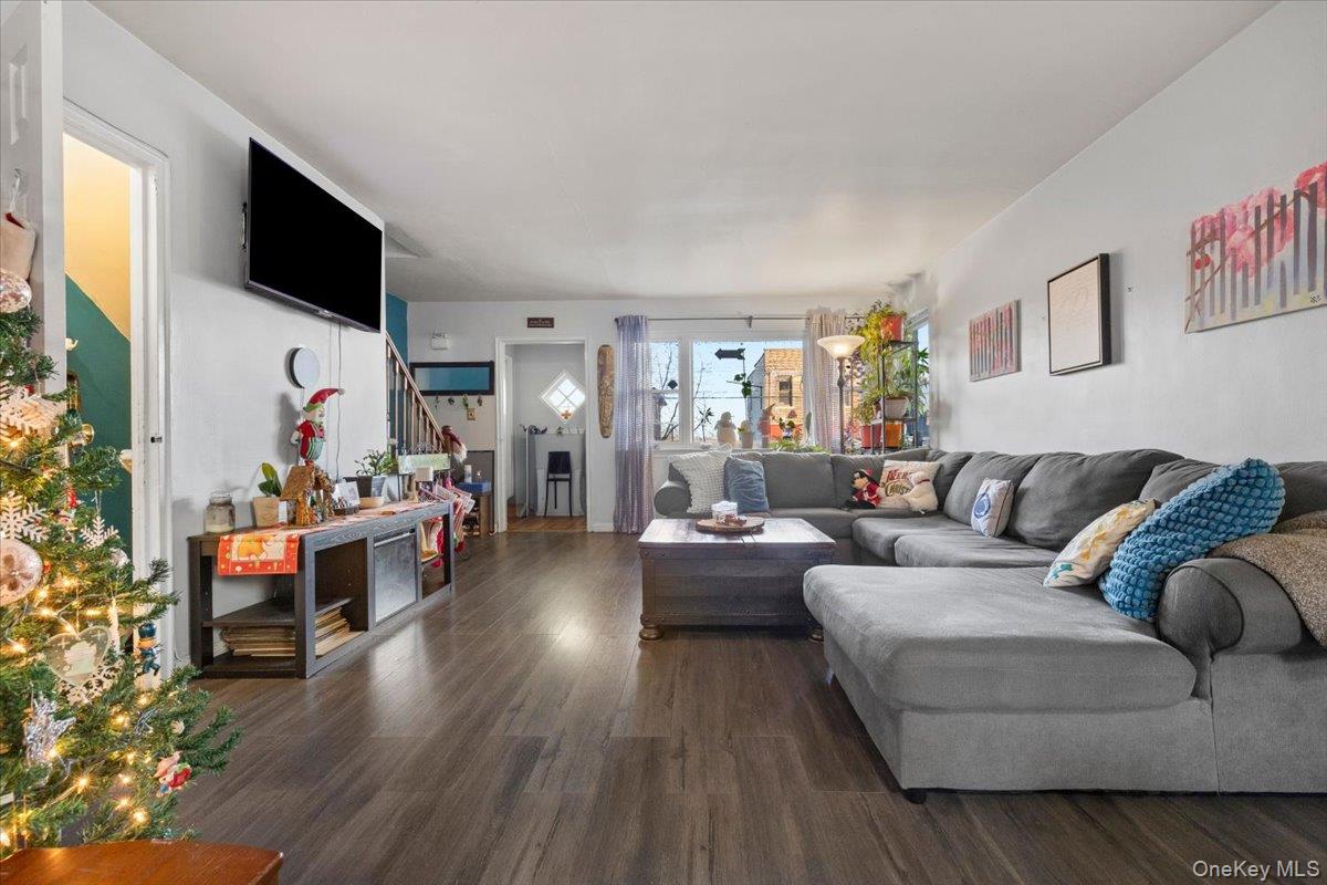 2761 Hering Avenue Bronx, NY 10469 - Photo 7 of 29 Living room with dark wood-type flooring and stairway