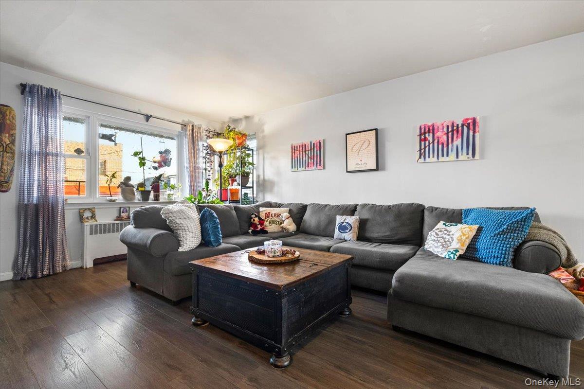 2761 Hering Avenue Bronx, NY 10469 - Photo 8 of 29 Living room featuring hardwood / wood-style flooring and radiator heating unit