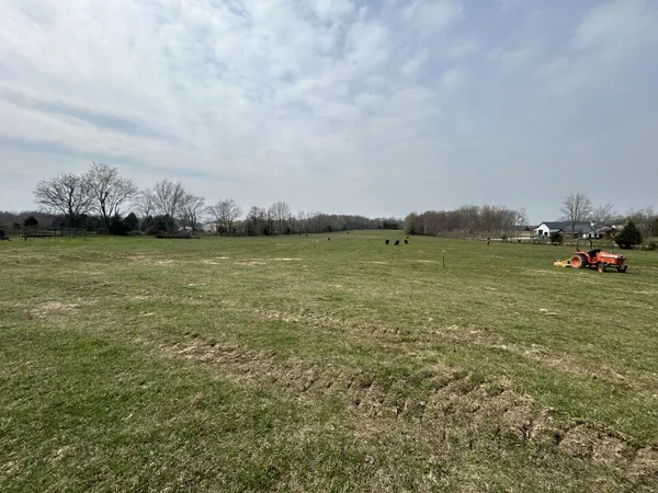 a view of a lake with houses in the back