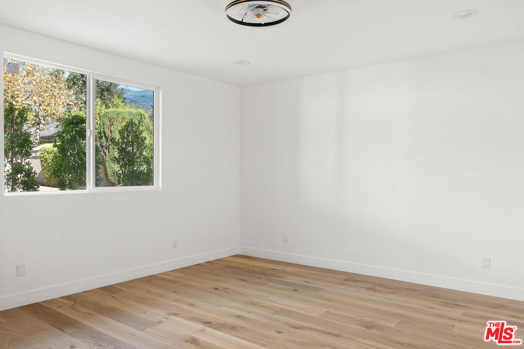 1795 Morada Place Altadena, CA 91001 - Photo 16 of 41 a view of an empty room with wooden floor and a window