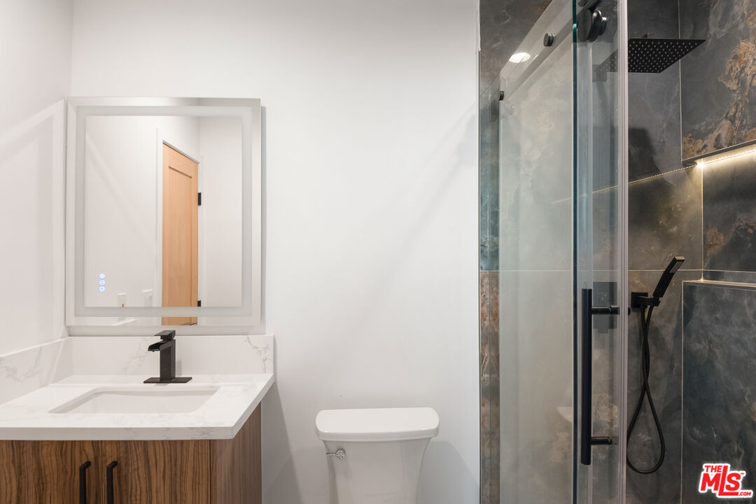 1795 Morada Place Altadena, CA 91001 - Photo 18 of 41 a bathroom with a sink a toilet and shower