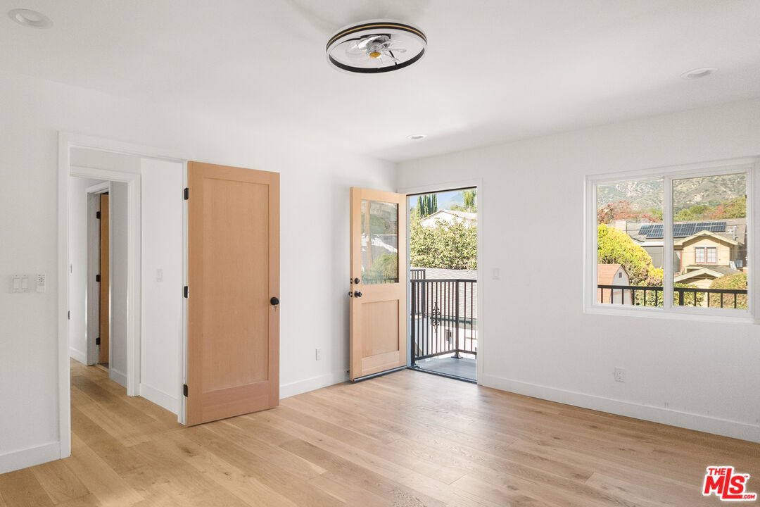 1795 Morada Place Altadena, CA 91001 - Photo 20 of 41 a view of a livingroom with wooden floor and a window