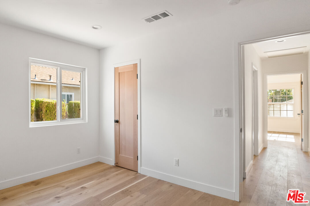 1795 Morada Place Altadena, CA 91001 - Photo 25 of 41 a view of an empty room with wooden floor and a window