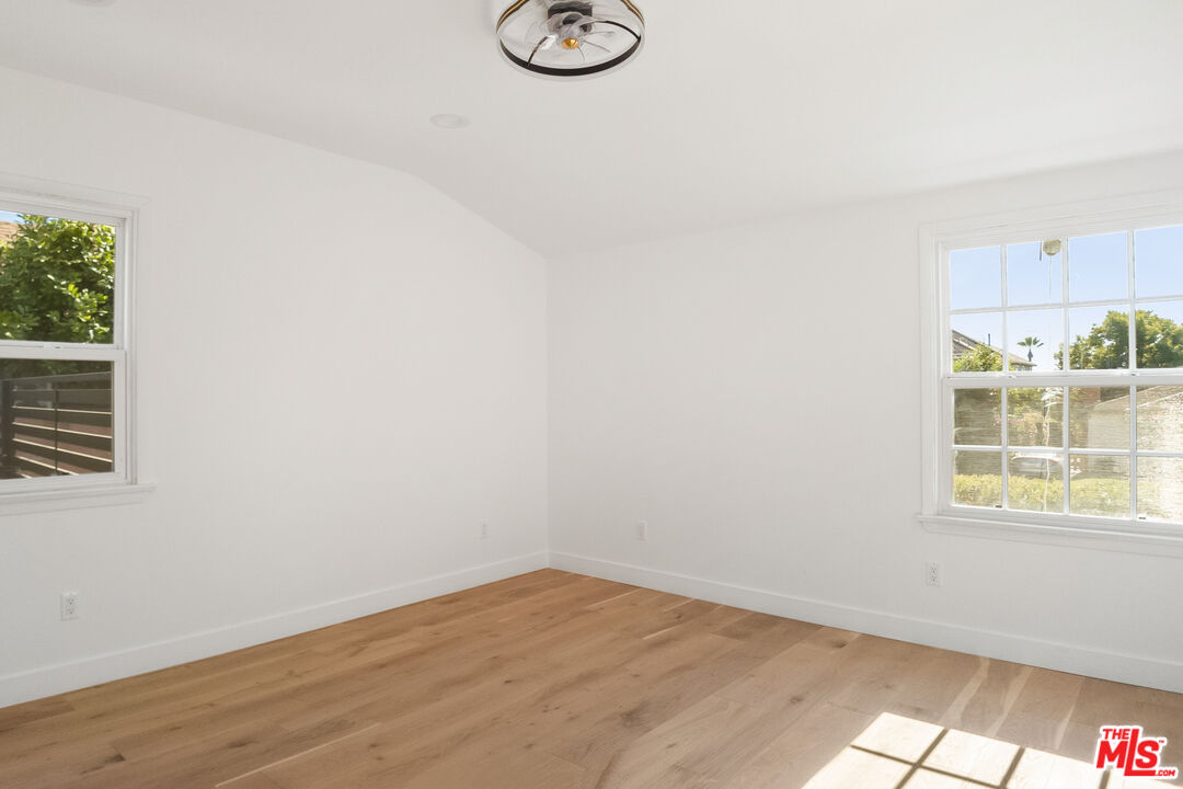 1795 Morada Place Altadena, CA 91001 - Photo 26 of 41 an empty room with wooden floor and windows