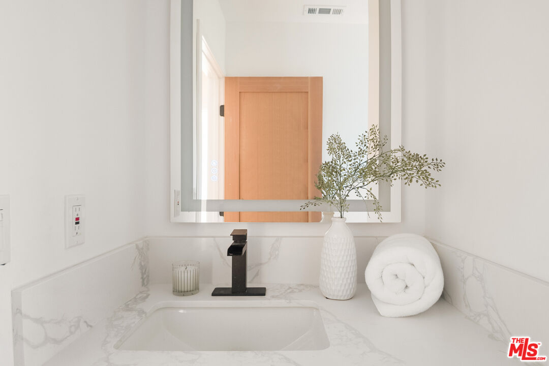 1795 Morada Place Altadena, CA 91001 - Photo 28 of 41 a bathroom with a sink and a mirror