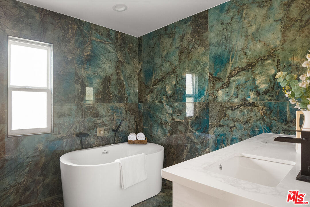 1795 Morada Place Altadena, CA 91001 - Photo 32 of 41 a white bath tub sitting in a bathroom next to a sink