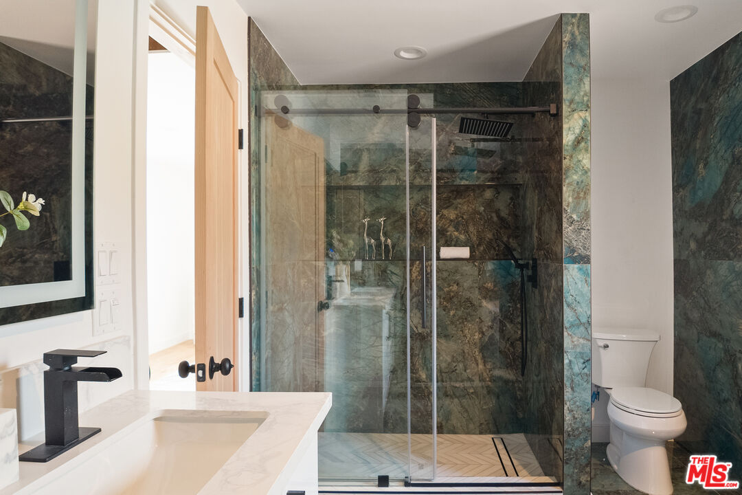 1795 Morada Place Altadena, CA 91001 - Photo 34 of 41 a bathroom with a shower and a toilet sink