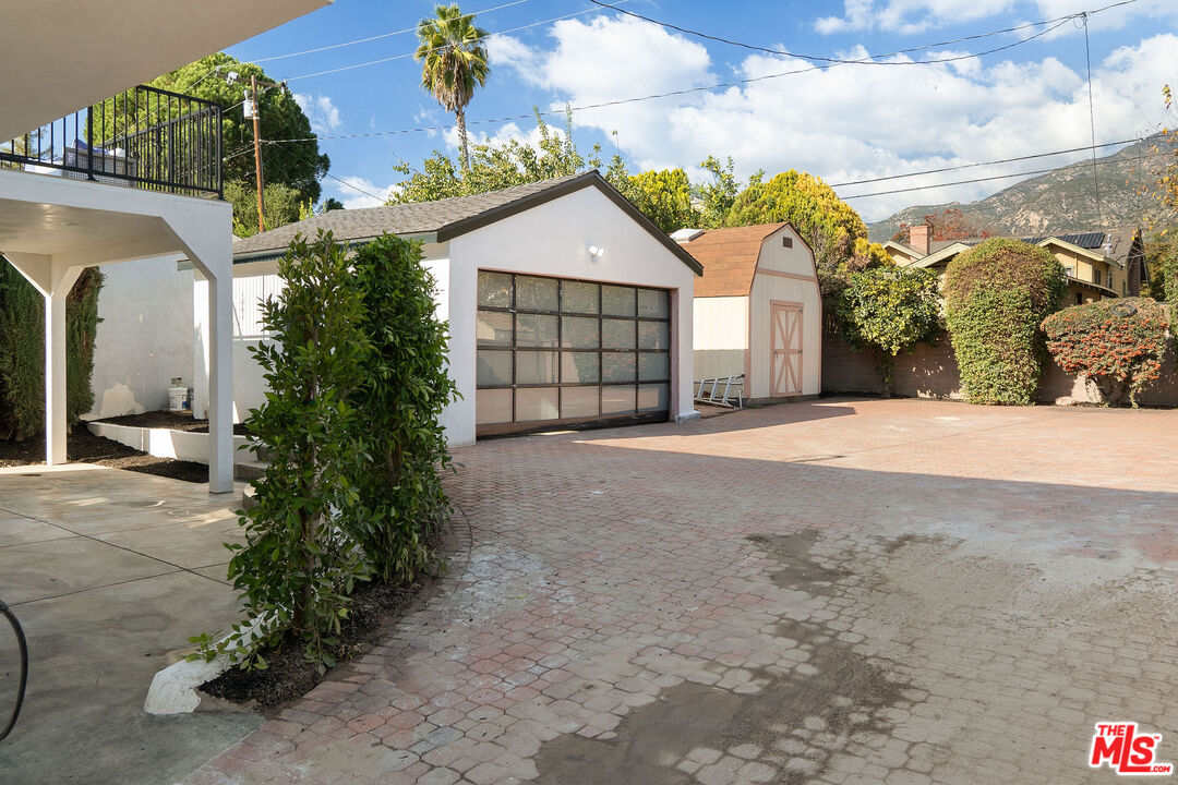 1795 Morada Place Altadena, CA 91001 - Photo 39 of 41 a view of a house with a yard and garage