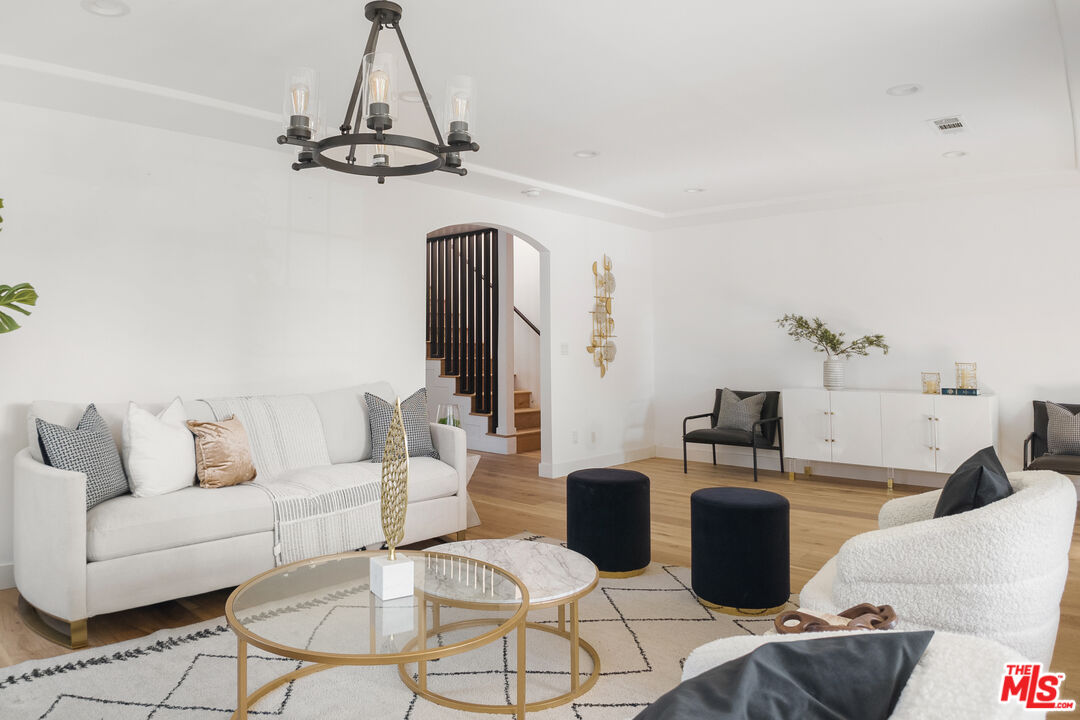 1795 Morada Place Altadena, CA 91001 - Photo 5 of 41 a living room with furniture a chandelier and a dining table