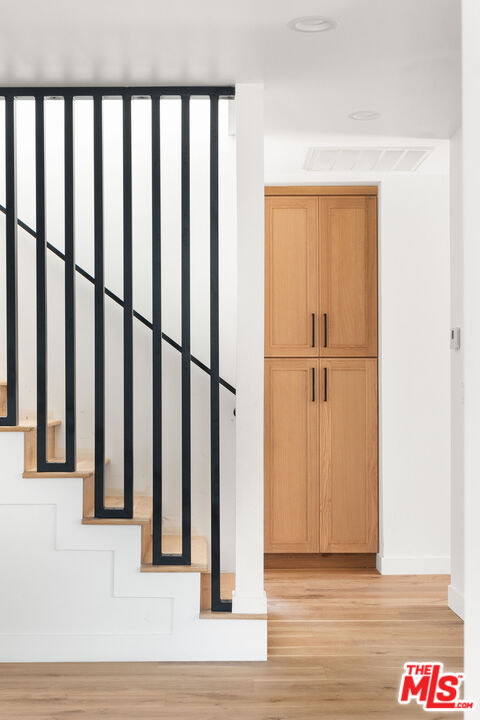 1795 Morada Place Altadena, CA 91001 - Photo 7 of 41 a view of a hallway with wooden floor and staircase