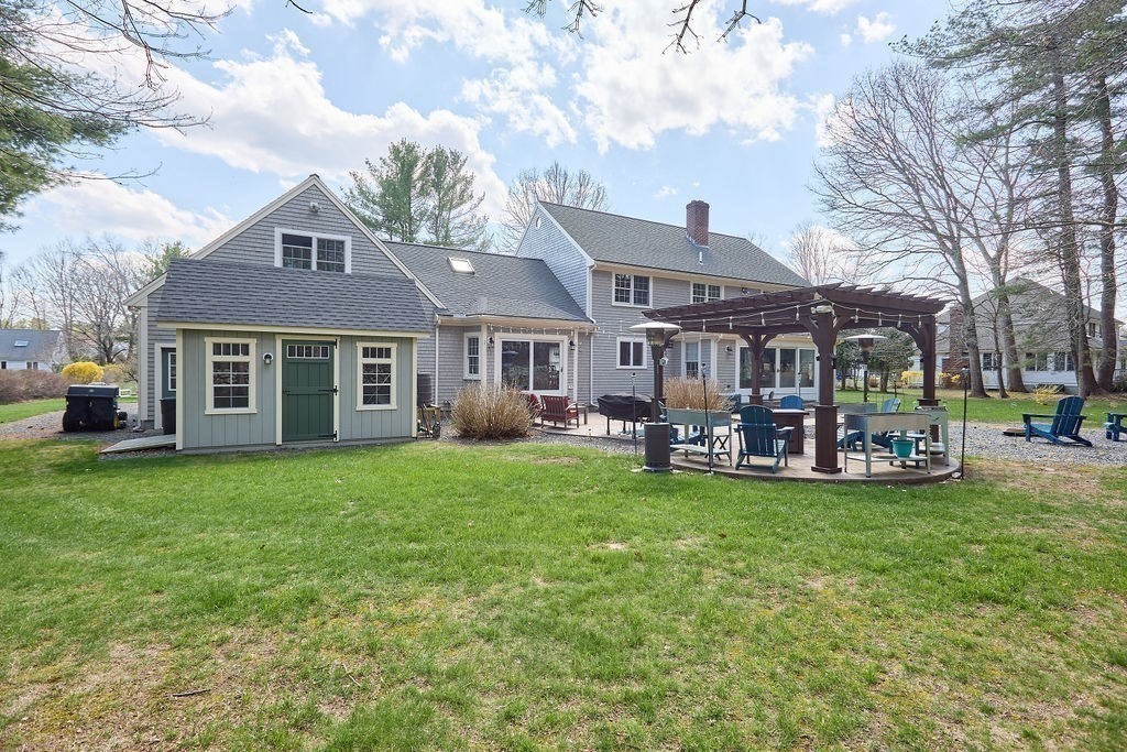 58 Buttercup Lane Hanover, MA 02339 - Photo 31 of 35 a view of a house with a yard and sitting area