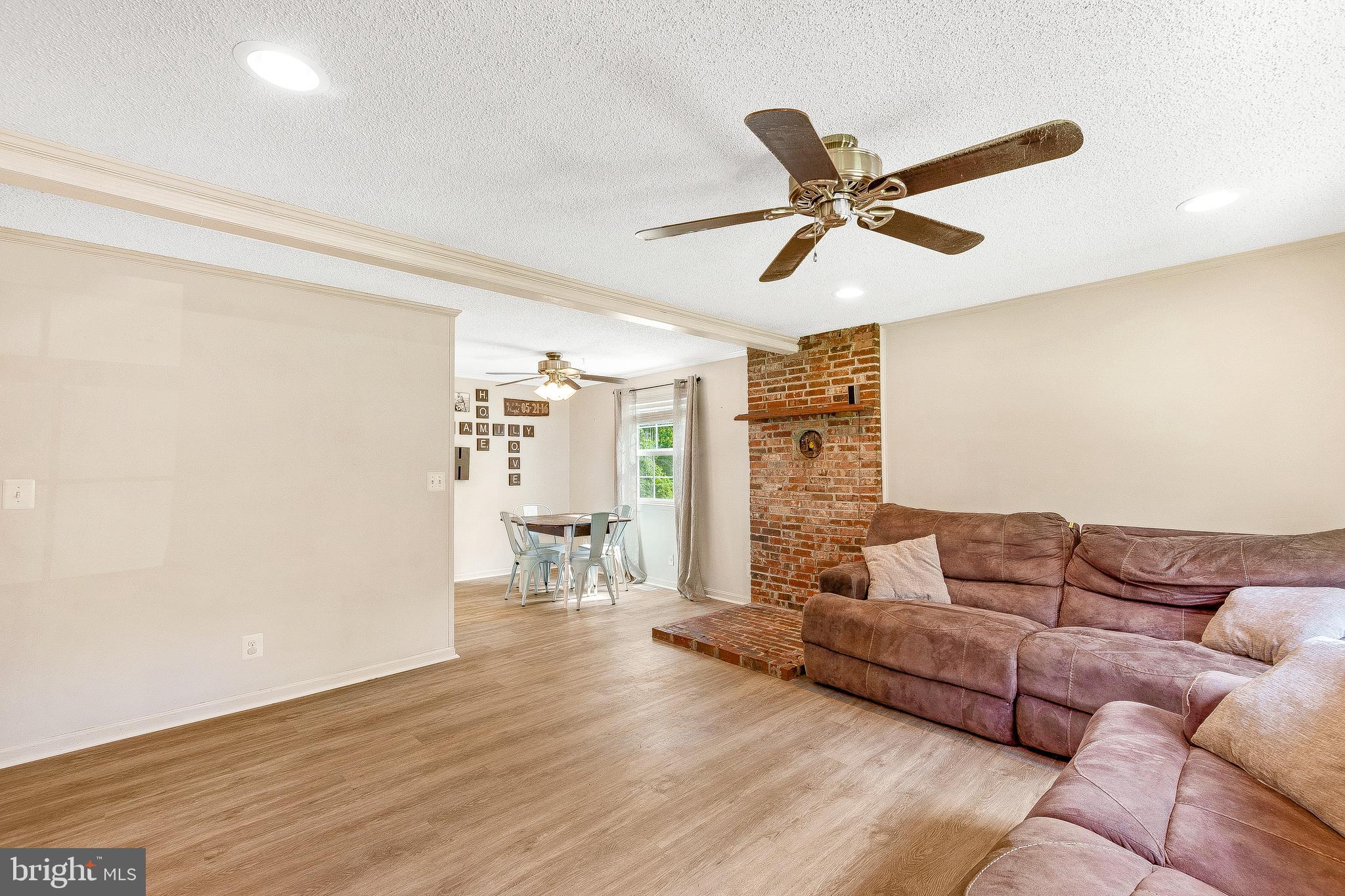 1158 Calvert Beach Road St. Leonard, MD 20685 - Photo 6 of 30 Exposed brick accent wall adds character