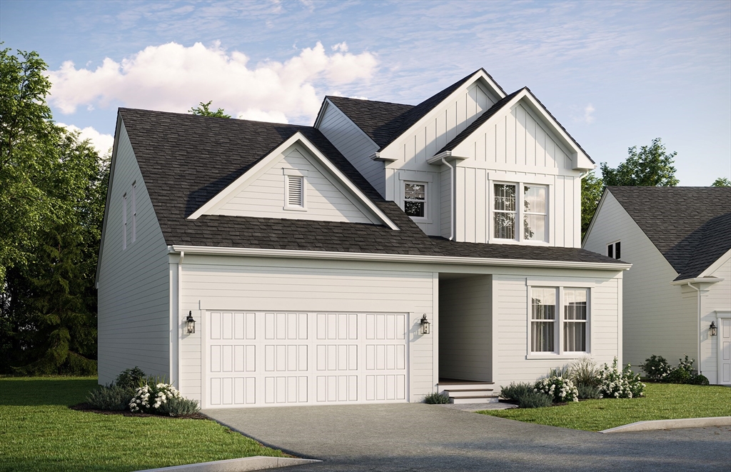 15 Sandtrap Circle, Unit 13 Walpole, MA 02081 - Photo 14 of 14 a front view of a house with a yard