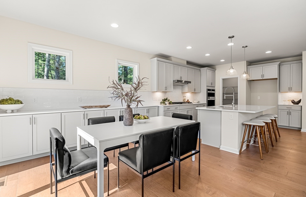 15 Sandtrap Circle, Unit 13 Walpole, MA 02081 - Photo 3 of 14 a view of a dining room with furniture and wooden floor