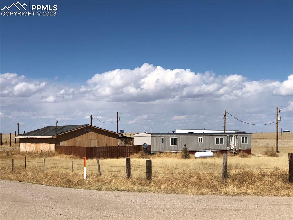a view of swimming pool with table and chairs