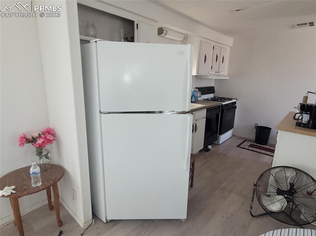 35294 Shear Road Yoder, CO 80864 - Photo 15 of 21 a white refrigerator freezer sitting inside of a kitchen