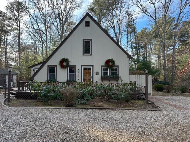 12 Sidewinder Road East Falmouth, MA 02536 - Photo 1 of 22 a view of a house with a yard and large trees