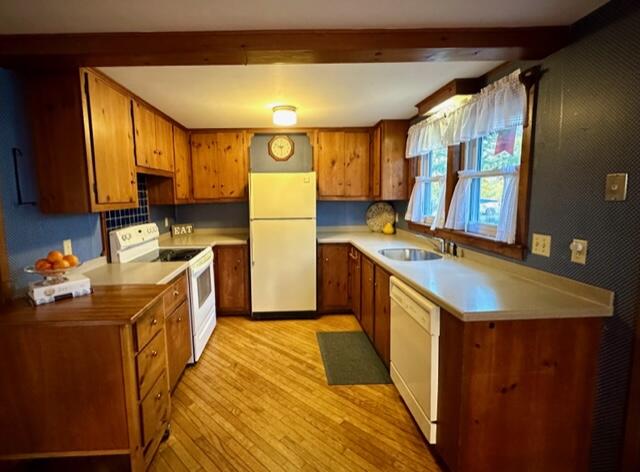 12 Sidewinder Road East Falmouth, MA 02536 - Photo 7 of 22 a kitchen with a sink a refrigerator and a stove