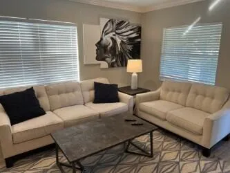 a living room with furniture and a window