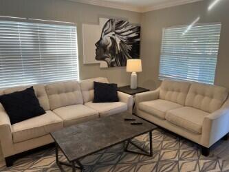 3125 Albatross Road, Unit B Delray Beach, FL 33444 - Photo 5 of 16 a living room with furniture and a window