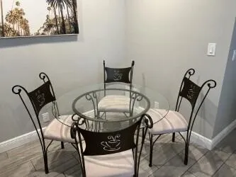 a view of a dining room with furniture and front door