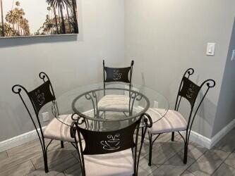 3125 Albatross Road, Unit B Delray Beach, FL 33444 - Photo 8 of 16 a view of a dining room with furniture and front door