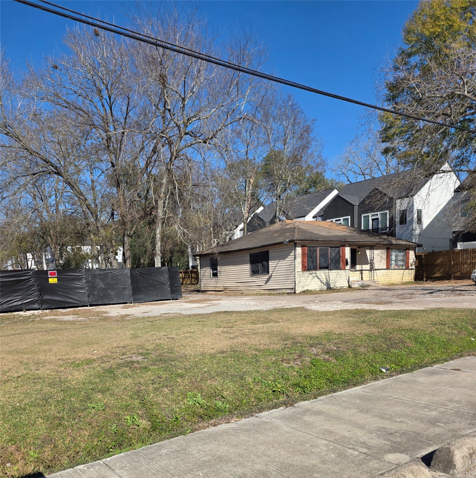 5101 Mallow Street Houston, TX 77033 - Photo 2 of 4 a front view of a house with a yard and garage