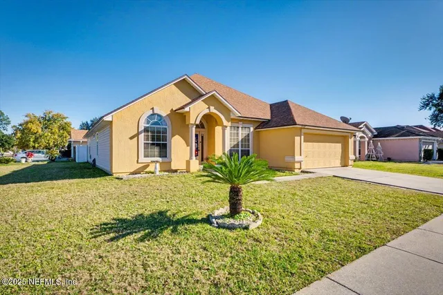 a front view of a house with a yard